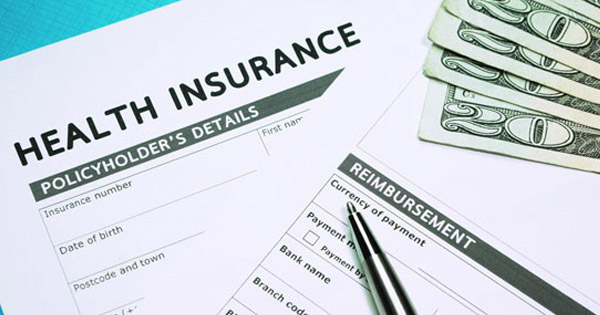 health insurance policy papers and money