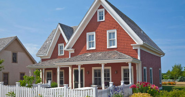 image of red house with fence