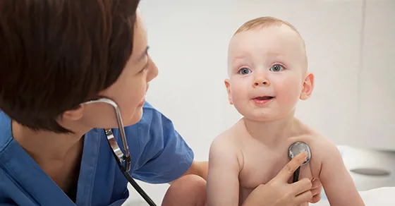 doctor examining baby