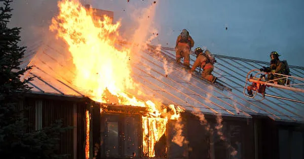 firefighters battling roof fire