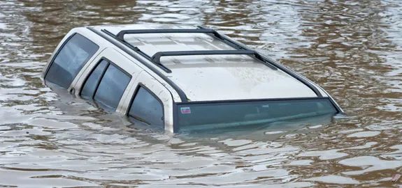 Car almost completely submerged by flood water