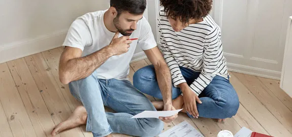 Couple looks at documents