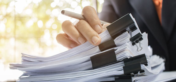 Man searching through documents