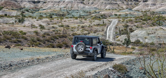 Jeep cruising on open road