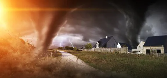 Tornadoes storm near country homes