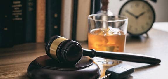 judges gavel whiskey and car key