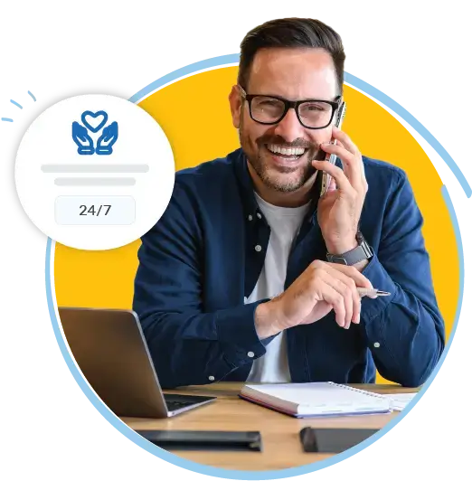 Man happy while on the phone with QuoteWizard support.